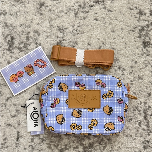 ALOHA Collection Handbags - Aloha Collection Hello Kitty Palaka Le Tour Crossbody Bag NWT